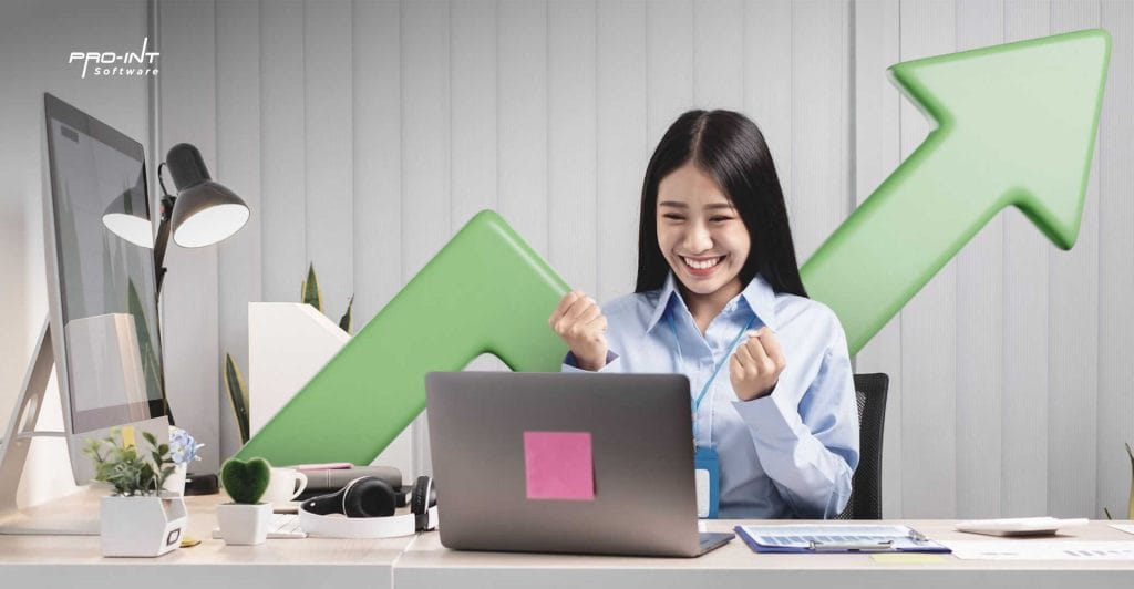 Optimistic young woman celebrating success with a boost arrow background working on HRIS and ERP system software in modern office environment symbolizing business growth and digital transformation